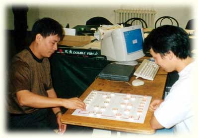 Pascal playing against GM Lu Qin, Chinese Chess Wolrd Champion